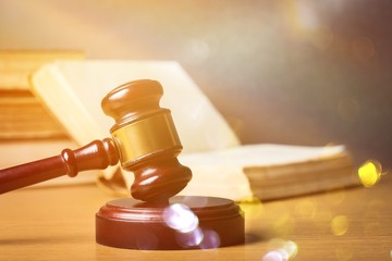Wooden gavel with book close up