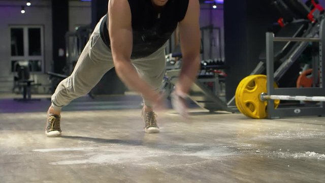 Athletic man doing push ups with clapping. Fitness, sport, exercising, training and lifestyle concept.