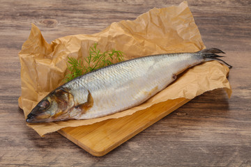 Salted herring over the wooden board