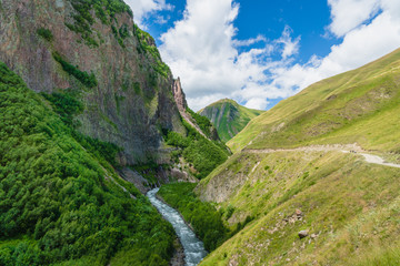  Truso Valley and Gorge area landscape on trekking / hiking route, in Kazbegi, Georgia. Truso valley is a scenic trekking route close to the border of North Ossetia.