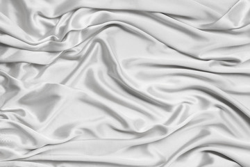 Obraz premium silk knitted fabric softly draped with small folds, texture, background, form for postcard, copy space