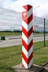 border striped red pillar with the national emblem on the border, with the inscription in Polish Poland