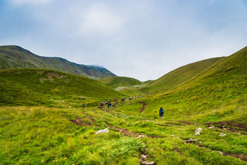 Obraz premium Kazbegi, Georgia - Mount Kazbegi landscape with dramatic clouds up in the trekking and hiking route.