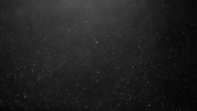 Abstract background with animation of flying and flickering particles as bokeh of light. Animation of seamless loop.Dust bubbles snow animation.