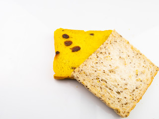 Whole wheat bread mixed with pumpkin and poppy, isolated on a white background.