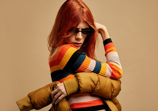 Portrait androgynous woman covering face