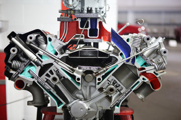 Engine split in half to display internal parts and mechanisms.