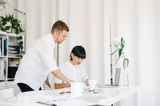 Stylish coworking designers in modern office - Powered by Adobe