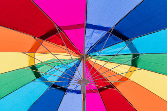 Close-up of the inside of a brightly colored umbrella.