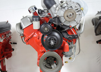 An American V8 combustion engine on display at an automotive shop.