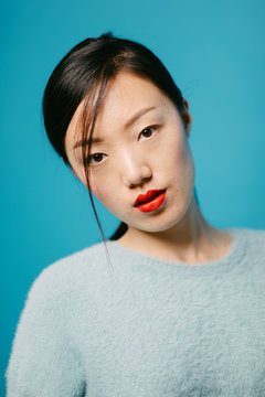 Portrait Of Asian Model With Red Lips