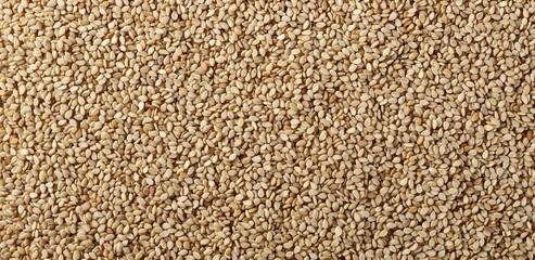 Organic integral sesame seeds background and texture, top view