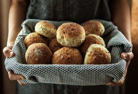 Woman With Bread In Basket