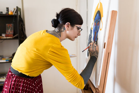 Artistic woman making handmade painting