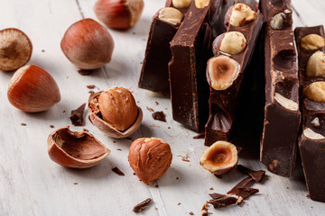 pieces of dark chocolate with hazelnuts