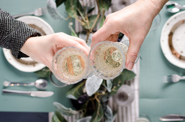 Fototapeta premium Top view of people toasting with glasses of red wine