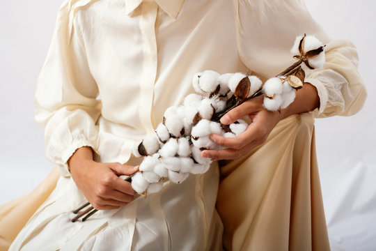 Anonymous Fashion Model Holding Cotton Branch