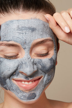Woman enjoying clay mask