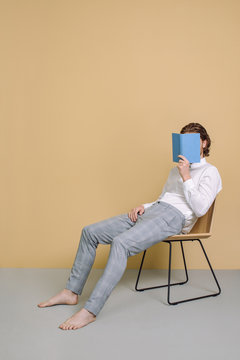 A Man Holding a Book