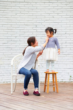 Little asian girl with her mother
