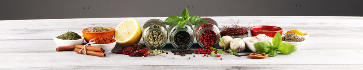Spices and herbs on table. Food and cuisine ingredients with basil