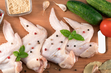 chicken wings on the kitchen board
