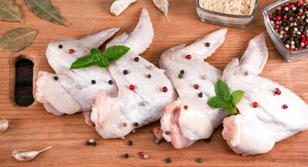 chicken wings on the kitchen board