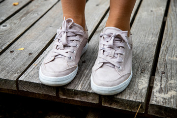 pink sneakers on a wooden background