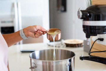 pouring egg white into bowl