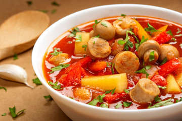 Stew or soup made from vegetables and german sausages