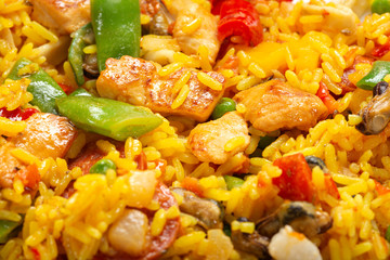 Traditional Spanish paella with seafood and chicken meat