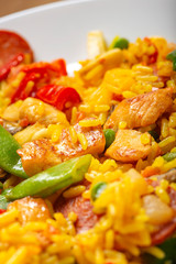 Traditional Spanish paella with seafood and chicken meat