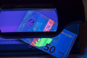 Banknote of 50 euros. authentication. close-up. there is tinting