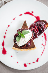 Chocolate Custard Tart Dessert with Concord Grape Compote and Vanilla Chantilly Cream
