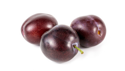 plums on a white background