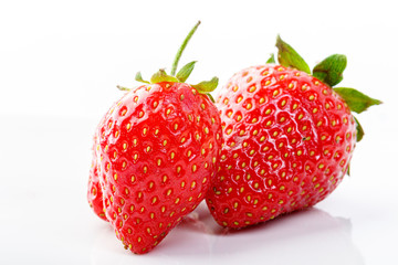 beautiful and ripe red strawberries on a white background