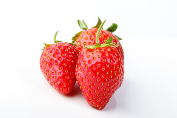 beautiful and ripe red strawberries on a white background