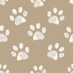 Seamless pattern for textile design. Light brown colored paw print pattern background