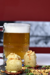 potato stuffed with meat and cheese au gratin