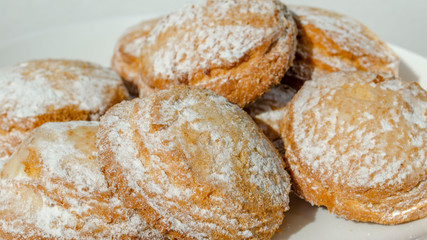 Gingerbread sprinkled with powdered sugar closeup