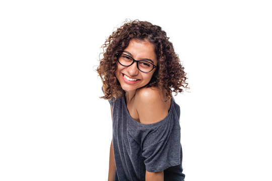 Portrait of a laughing Indian young woman on a white background. Smiling mixed race girl on a white isolated background.