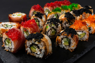 Philadelphia roll sushi with salmon, prawn, avocado, cream cheese. Sushi menu. Japanese food.