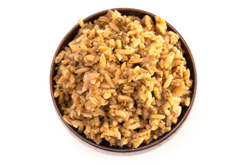 Cajun Dirty Rice in a Wooden Bowl on a White Background