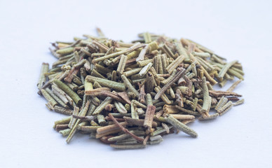 macro of rosemary spice on a white background