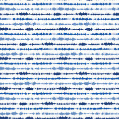 Indigo blue shibori tie dye horizontal stripe. Seamless pattern background. Japanese style batik textile. Variegated for summer fashion swatch.