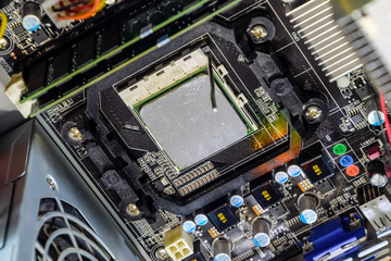 The processor of the computer with the thermal paste applied on it. Details of the computer's system unit.