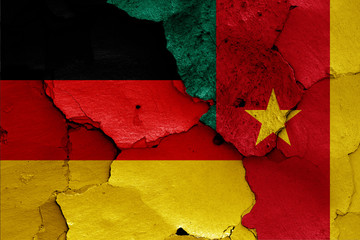 flags of Germany and Cameroon painted on cracked wall