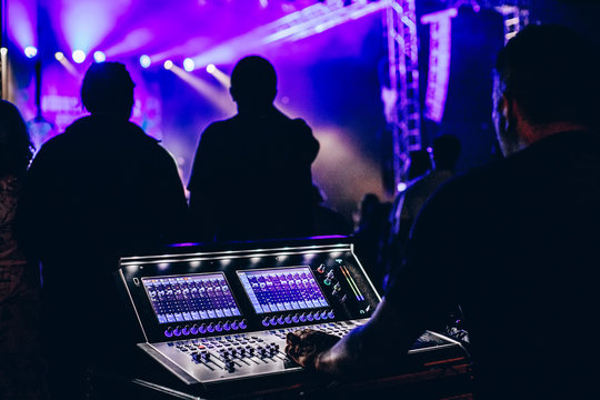 Professional sound engineer console at concert.