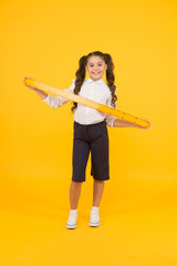 Geometry school subject. Education and school concept. Sizing and measuring. School student study geometry. Tell me about distance. Kid school uniform hold ruler. Pupil cute girl with big ruler