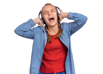 Portrait of happy teen girl with headphones, isolated on white background. Cheerful beautiful child listening to music and singing song. Emotional portrait of cute caucasian teenager enjoying music.